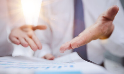 Obraz premium Close-up of business people in smart discussing something while looking at the graphs and charts