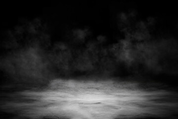 Concrete floor with smoke or fog in dark room with spotlight. Asphalt night street, black...