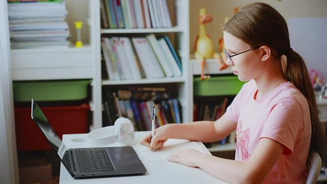 Schoolgirl studying online