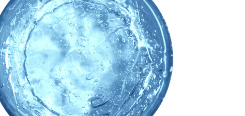 Transparent blue cosmetic gel in a round jar. View from above. On an empty background.