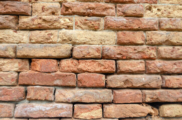 Grunge brick wall of an ancient Venetian building for your background. Italian architecture and...