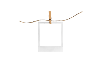 polaroid on clothespin / polaroid frame and clothespin attached to a rope isolated on white background 