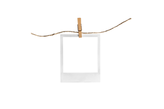 polaroid on clothespin / polaroid frame and clothespin attached to a rope isolated on white background 
