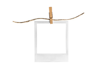 polaroid on clothespin / polaroid frame and clothespin attached to a rope isolated on white...