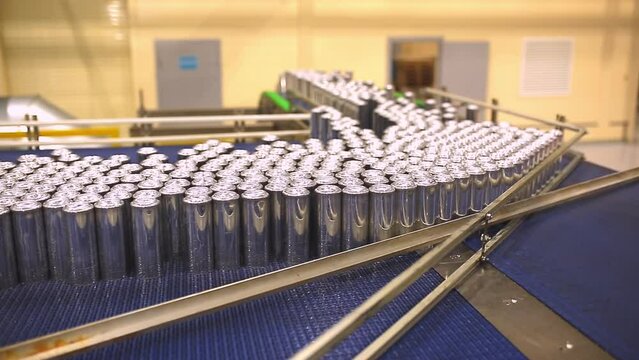 Conveyor line with the production of aluminum cans. Production of aluminum cans for drinks. Plant of high-tech equipment for the food industry.