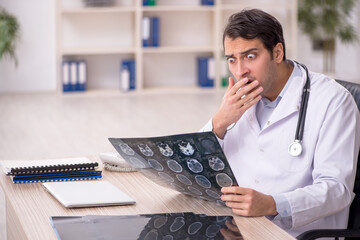 Young male doctor radiologist working in the clinic