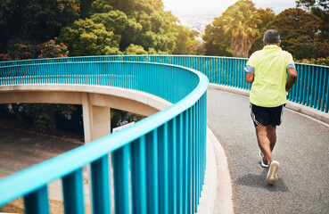 Old man on bridge, running for fitness and cardio, back view with speed and training for marathon, wellness and vitality. Runner in street, performance and challenge with exercise, health and workout