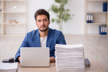 Young male employee working in the office