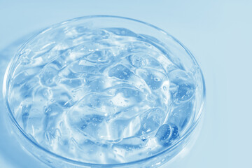 blue transparent cosmetic or medical gel in a Petri dish