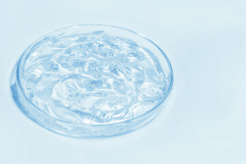 blue transparent cosmetic or medical gel in a Petri dish
