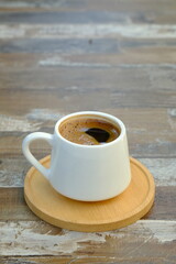 A cup of Turkish coffee on wooden table