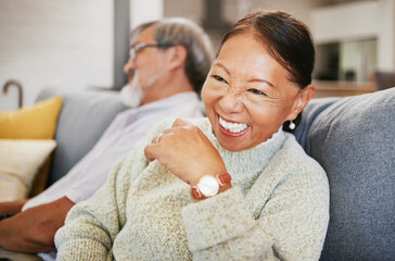 Mature, woman and laugh on sofa with smile in lounge for joke on holiday, vacation or retirement....