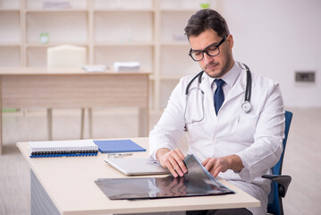 Young male doctor radiologist working in the clinic