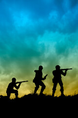Fototapeta na wymiar patrol of soldiers on a ridge, silhouettes