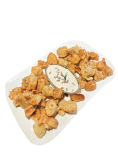 snack pieces of chicken in dough with garlic sauce, dish
