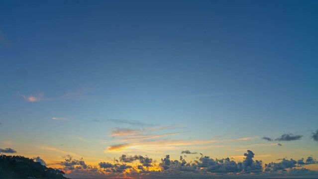 .time lapse Clouds filled the sky..the sun down in horizon at beautiful sunset.Nature video High quality footage. .Scene of Colorful romantic sky sunset with cloud moving in sky background..