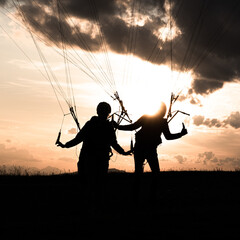 silhouette of a person paraglider