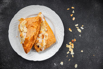 almond triangle cake cream puff pastry sweet dessert delicious healthy eating cooking appetizer meal food snack on the table copy space