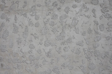 Gray concrete on a textured mesh.