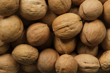 Background of walnuts in closeup macro photograph.