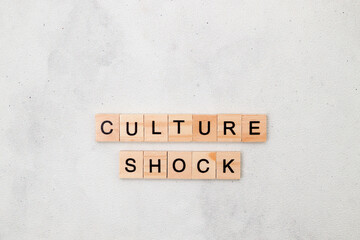 Top view of Culture Shock word on wooden cube letter block on white background. Business concept