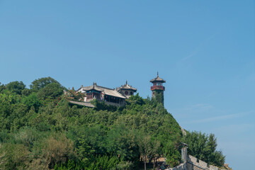The ancient city walls at sea and the watchtower on the mountain, the Penglai Pavilion in Yantai