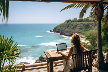 Back view of  woman working on laptop at table on tropical beach, Digital nomad’s lifestyle,  Remote job and teleworking concept, Vacation Leave, Travel visa
