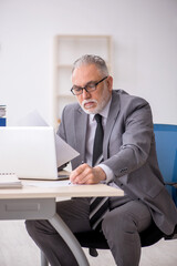 Old male employee and too much work in the office