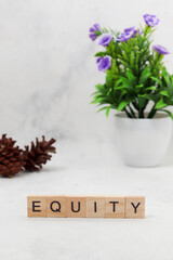Top view of Equity word on wooden cube letter block on white background. Business concept