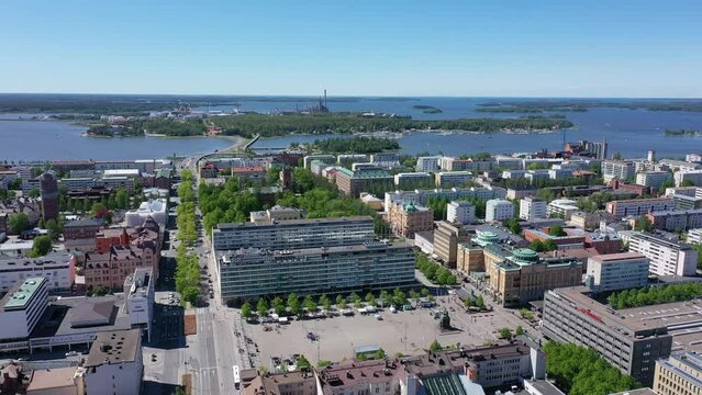 Aerial footage of the center of Vaasa on a sunny day with Vaasa harbour on the horizon, Finland