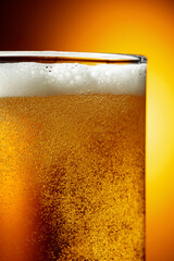 Glass of tasty beer with foam, closeup.