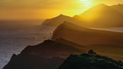 Ferriter's Cove, Ireland. Sunset on top of the steep cliffside. - obrazy, fototapety, plakaty