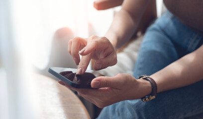 Close up of woman hand holding, using mobile phone for online shopping, digital payment via mobile banking app, social media, internet network, business and technology, people lifestyle