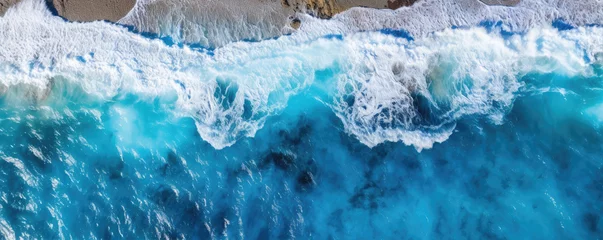  Sea waves or ocean surface from aerial view. Blue water with foam, copy space for text. © Michal