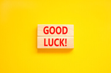 Good luck symbol. Concept words Good luck on beautiful wooden block. Beautiful yellow table yellow background. Business, motivational good luck concept. Copy space.