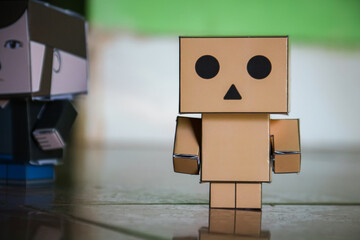 Obraz premium Conceptual image of a man made of cardboard box with face