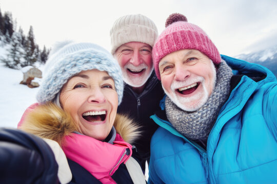 Happy group of senior people smiling at camera outdoors.  Older friends taking selfie picture with smartphone, life style concept with pensioners having fun together on winter holiday