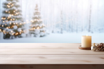 Empty wooden table in front of  winter holiday background with snowy Christmas tree and candles