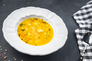 rice soup vegetable broth, potato, carrot, onion healthy eating cooking appetizer meal food snack on the table copy space food background rustic top view keto or paleo diet vegetarian vegan