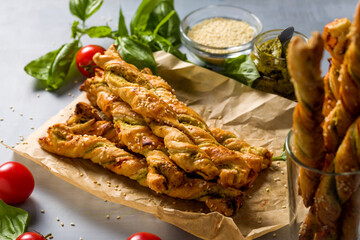 Bread sticks with sesame and tomato with pesto sauce