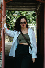 Lady girl in white happy smiling, long hair, in sunglasses. Emotional joyful posing. Beautiful young woman. background brick arch.	