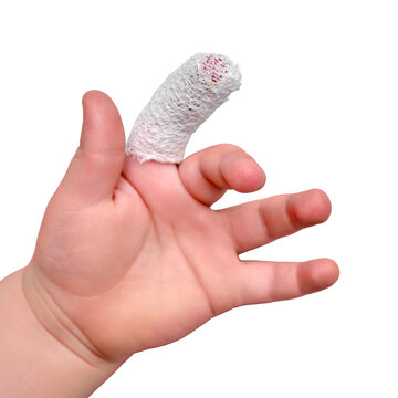 Baby S Hand With A Bandaged Finger On A White Isolated Background, Close-up. Injured Index Finger Of A Child Wrapped In A White Bandage. Kid Boy Aged One Year And Three Months