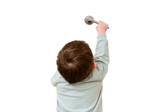 Little baby opens the door, isolated on white background. Child pulls the door handle with the lock closed, isolated on white background. Kid aged two years