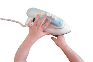 The child's careless behavior in playing with a hot iron in the living room could result in burns or injuries to the baby if left unsupervised, isolated on white background. Kid aged about two years