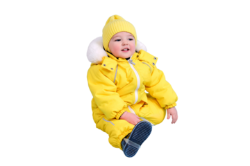 Happy toddler baby in winter clothes snowsuit isolated on a white background. A child in a warm yellow jumpsuit with a hood. Kid aged one year five months
