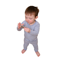 Toddler baby opened the cabinet drawer with pills and medicine, isolated on white background. Child boy holding a pack of pills in the home living room. Kid age one year nine months