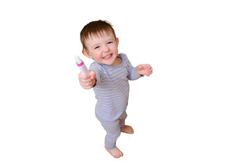 Toddler baby opened the cabinet drawer with pills and ointment, isolated on white background. Child boy holding cream standing in home living room. Kid age one year nine months