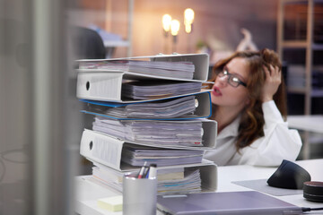Overworked Business Woman With Stack Or Pile