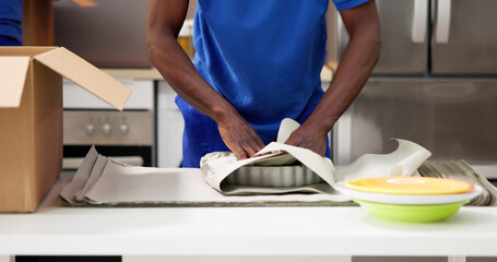 Packing Dishes In Home Apartment Room