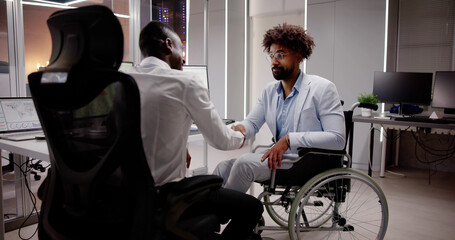 Business Person In Wheel Chair Shaking